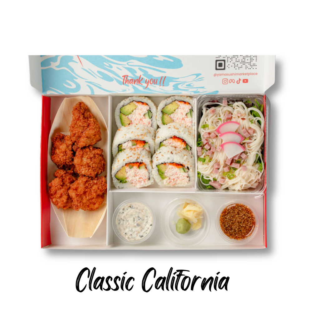 A bento box featuring fried chicken, sushi rolls, a salad with noodles, and various condiments.